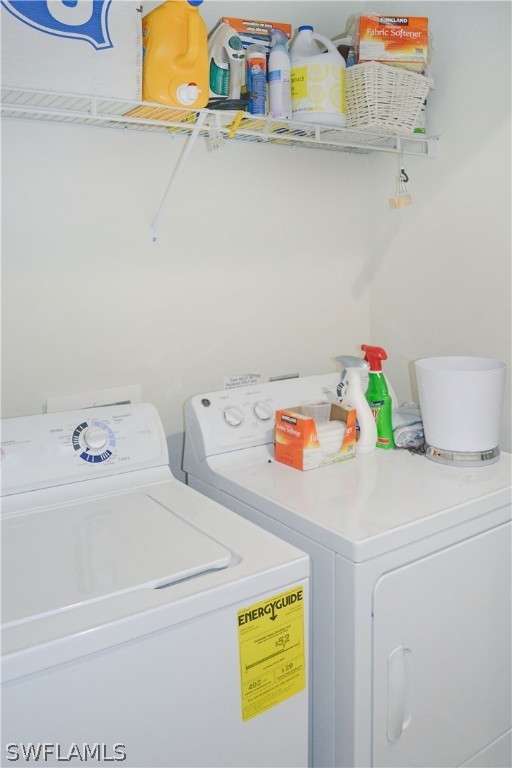 9048 Triangle Palms Lane, Unit 1106 Fort Myers, FL 33913 - Photo 22 of 29 a utility room with dryer and washer