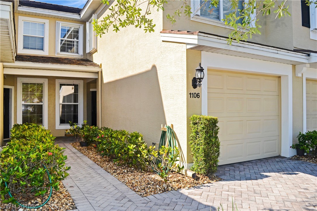 9048 Triangle Palms Lane, Unit 1106 Fort Myers, FL 33913 - Photo 27 of 29 a front view of a house