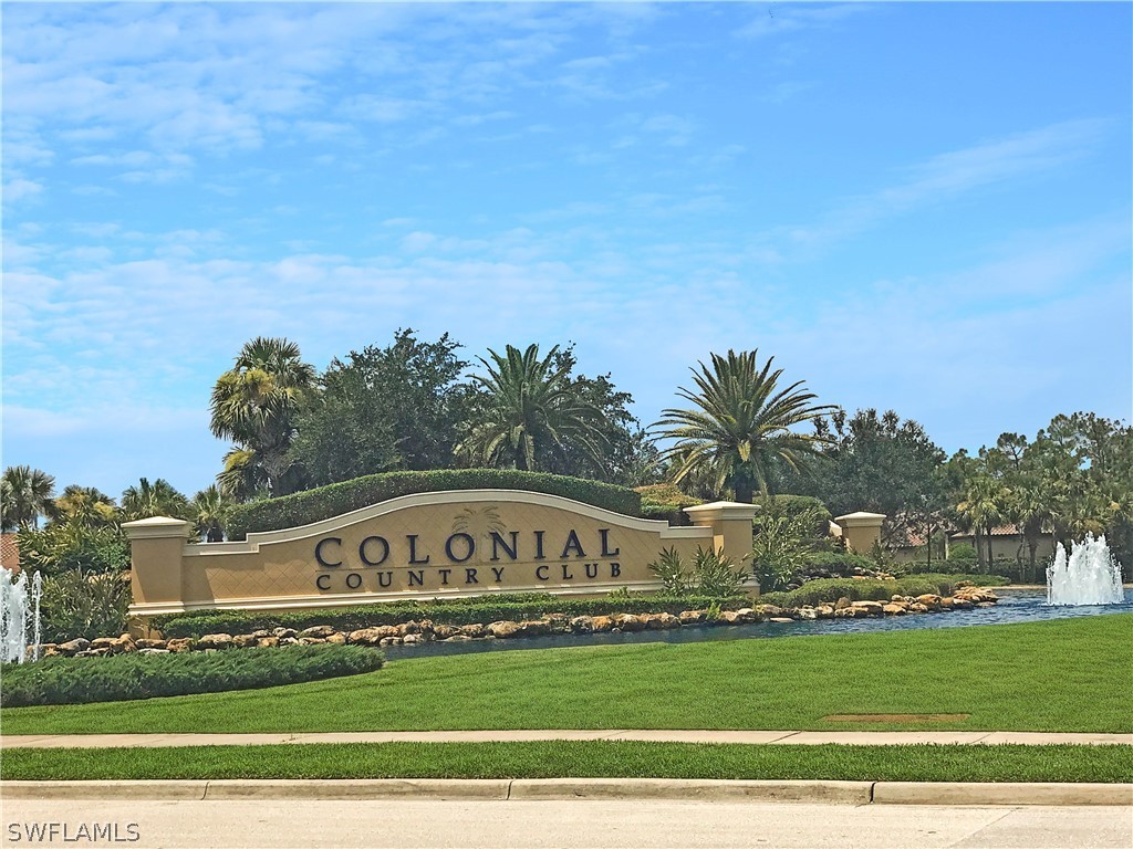 9048 Triangle Palms Lane, Unit 1106 Fort Myers, FL 33913 - Photo 28 of 29 a sign board with a house in the background