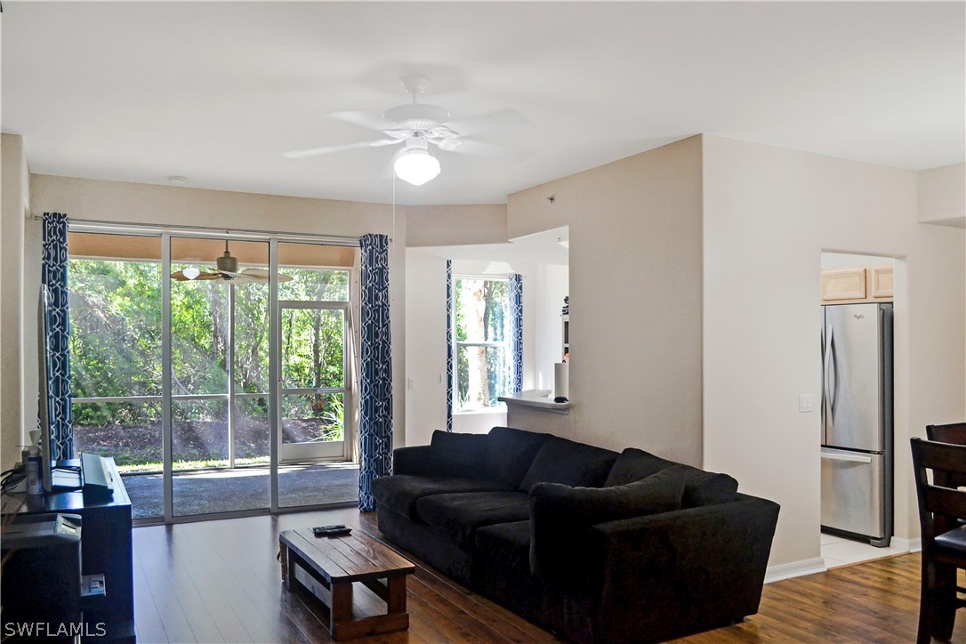 9048 Triangle Palms Lane, Unit 1106 Fort Myers, FL 33913 - Photo 4 of 29 a living room with furniture and a large window
