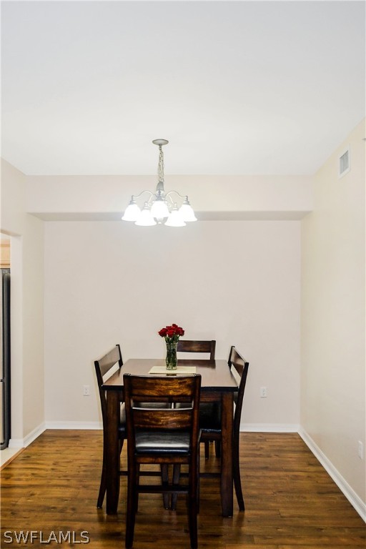 9048 Triangle Palms Lane, Unit 1106 Fort Myers, FL 33913 - Photo 6 of 29 a view of a dining room with furniture and wooden floor