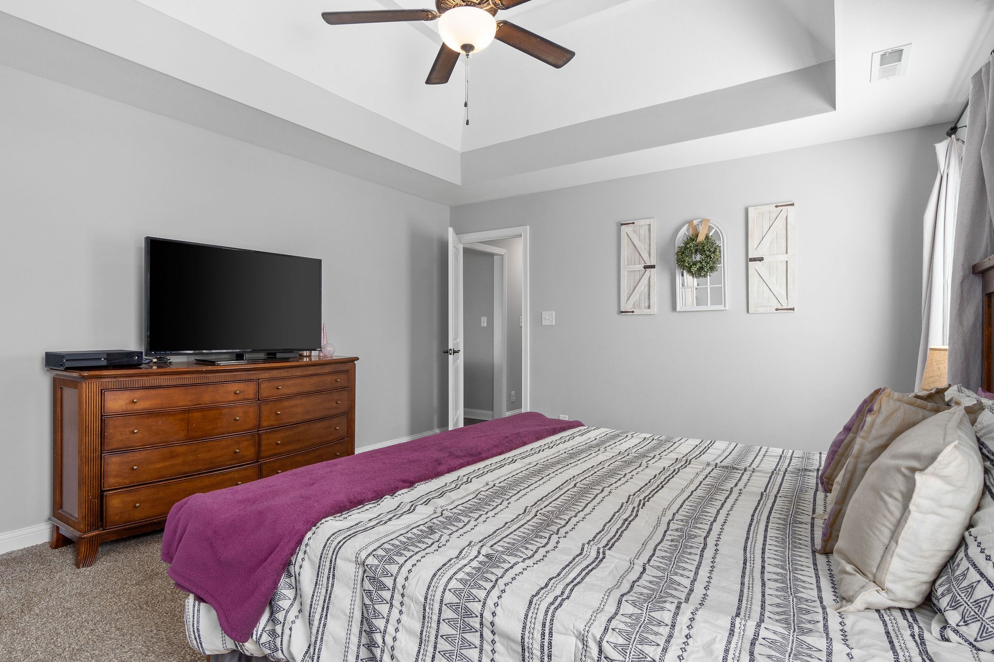 1036 Rushmore Road Clarksville, TN 37042 - Photo 17 of 32 a bedroom with a bed and a flat screen tv