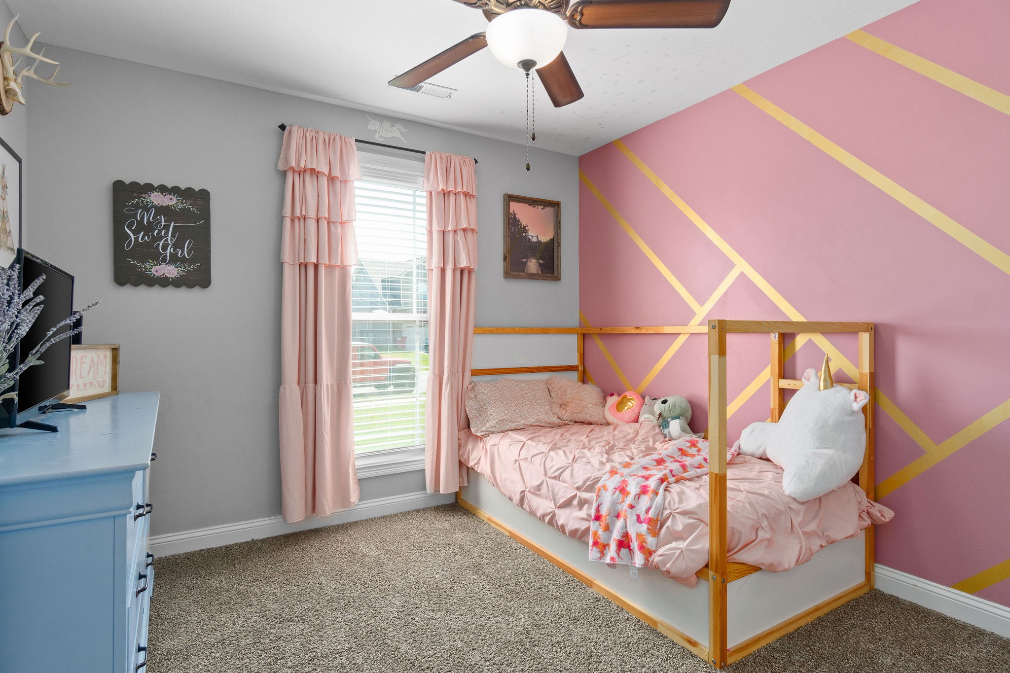 1036 Rushmore Road Clarksville, TN 37042 - Photo 23 of 32 a bedroom with a bed and a chandelier