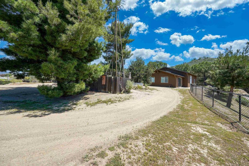 21057 Sutherland Dam Road Ramona, CA 92065 - Photo 18 of 66 a view of a yard with a tree