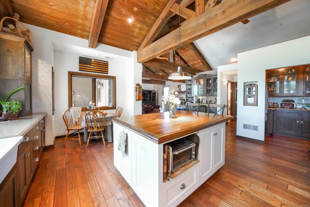 21057 Sutherland Dam Road Ramona, CA 92065 - Photo 27 of 66 a kitchen that has a table and chairs in it