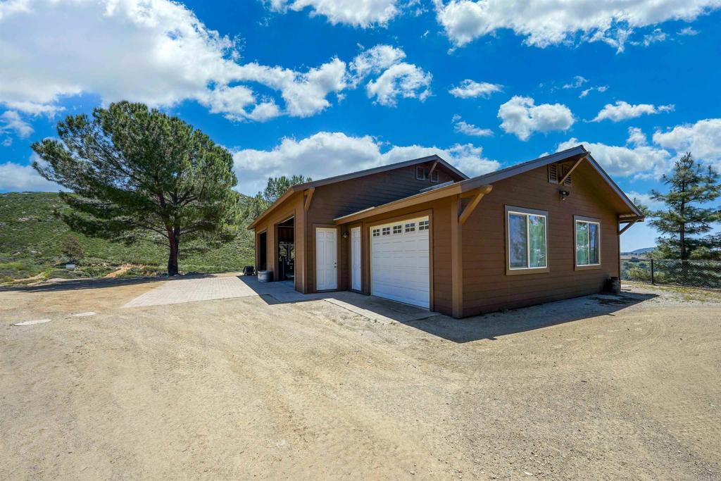 21057 Sutherland Dam Road Ramona, CA 92065 - Photo 47 of 66 a view of a house with a yard