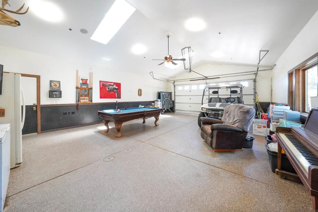 21057 Sutherland Dam Road Ramona, CA 92065 - Photo 50 of 66 a living room with furniture kitchen view and a chandelier