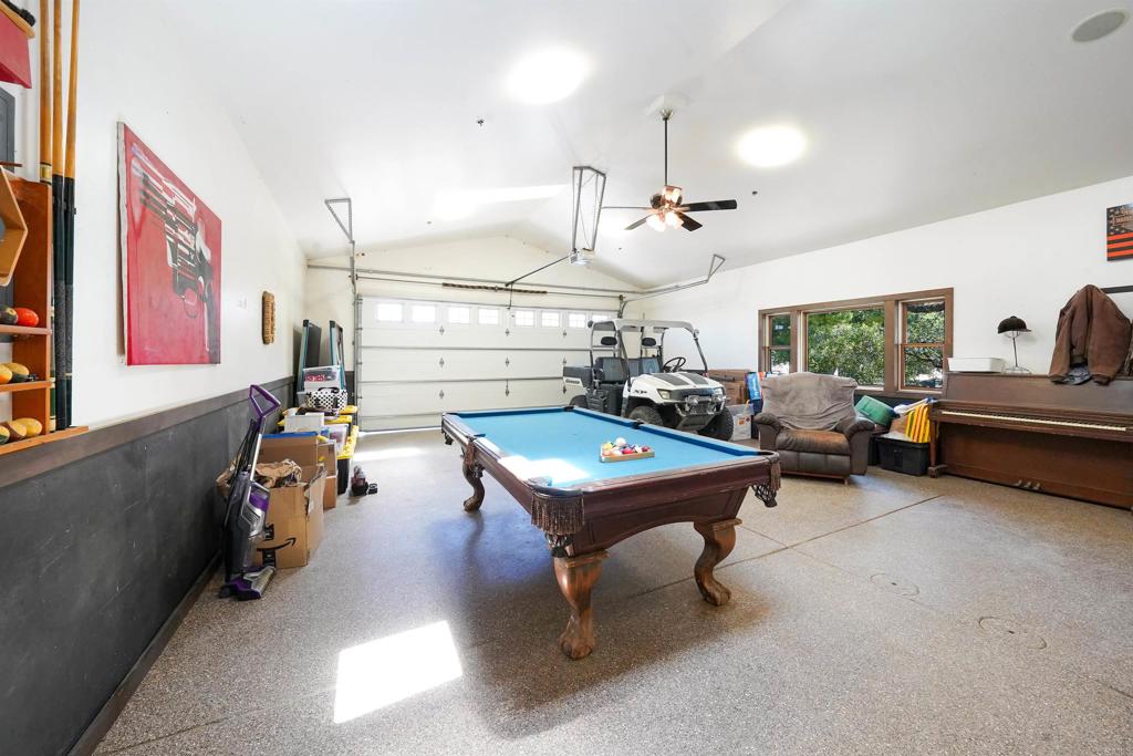 21057 Sutherland Dam Road Ramona, CA 92065 - Photo 51 of 66 a living room with furniture gym equipment and a flat screen tv
