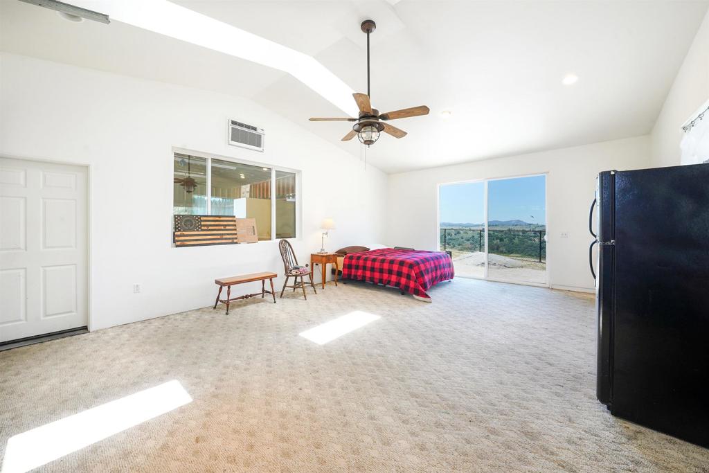 21057 Sutherland Dam Road Ramona, CA 92065 - Photo 53 of 66 a living room with furniture and a window