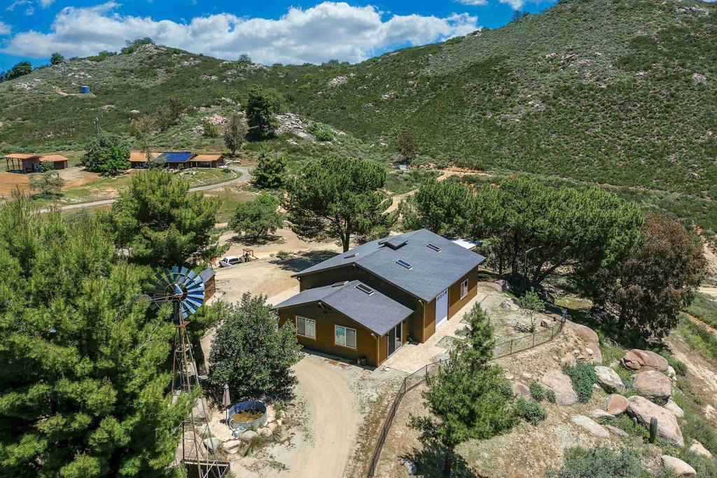 21057 Sutherland Dam Road Ramona, CA 92065 - Photo 63 of 66 an aerial view of a house with a yard