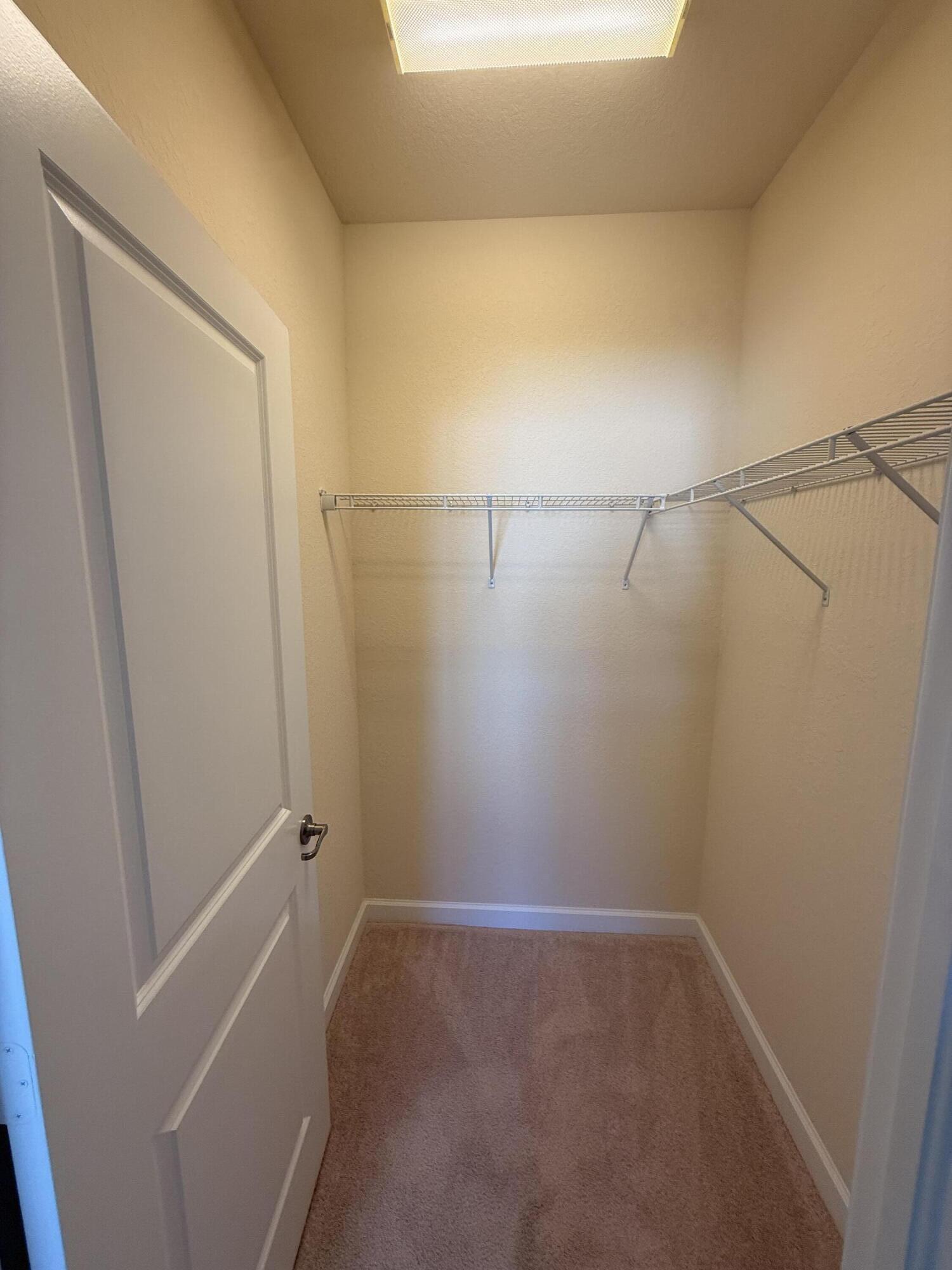 148 Northwest Emerson Place Boca Raton, FL 33432 - Photo 27 of 45 Middle Bedroom Walk-in Closet