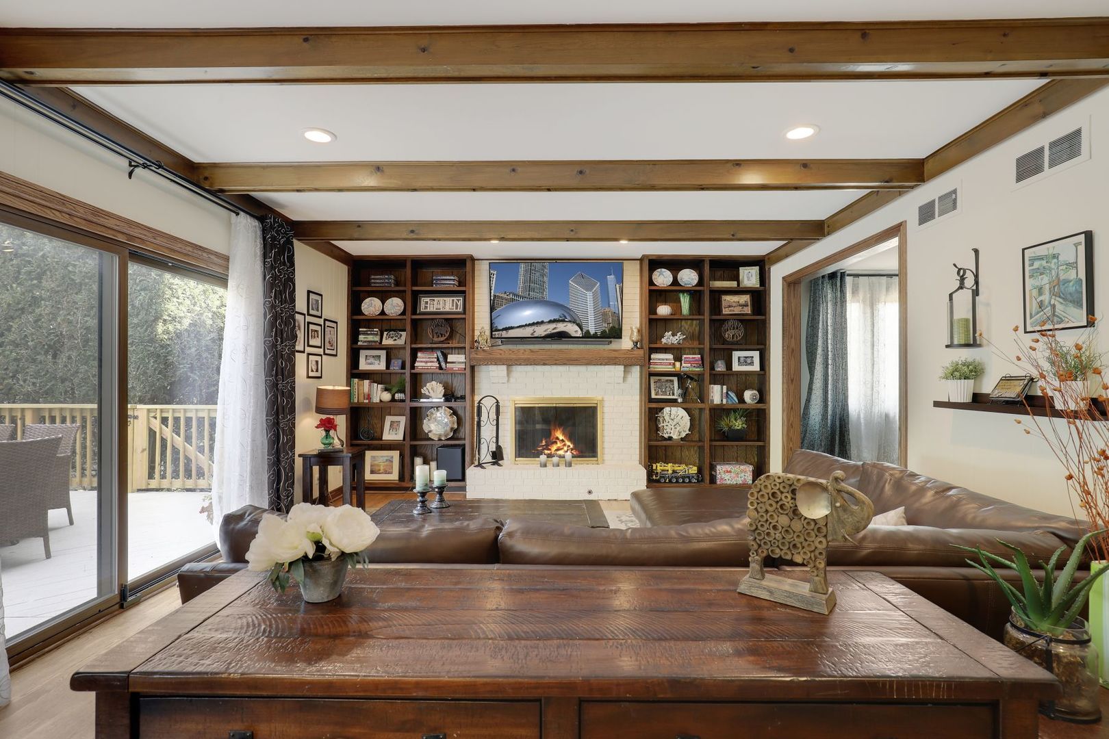 11400 Burr Oak Lane Burr Ridge, IL 60527 - Photo 12 of 40 a living room with fireplace furniture and a potted plant