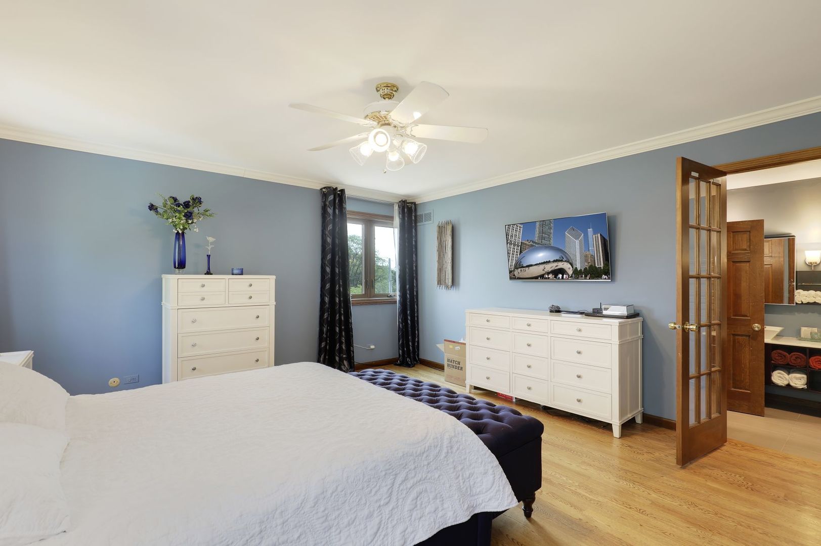 11400 Burr Oak Lane Burr Ridge, IL 60527 - Photo 18 of 40 a bedroom with a bed and a dresser