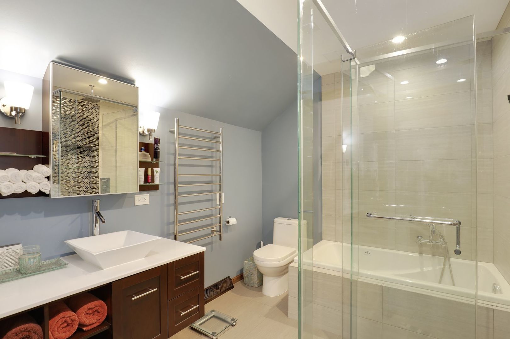 11400 Burr Oak Lane Burr Ridge, IL 60527 - Photo 20 of 40 a bathroom with a sink a toilet a mirror and shower