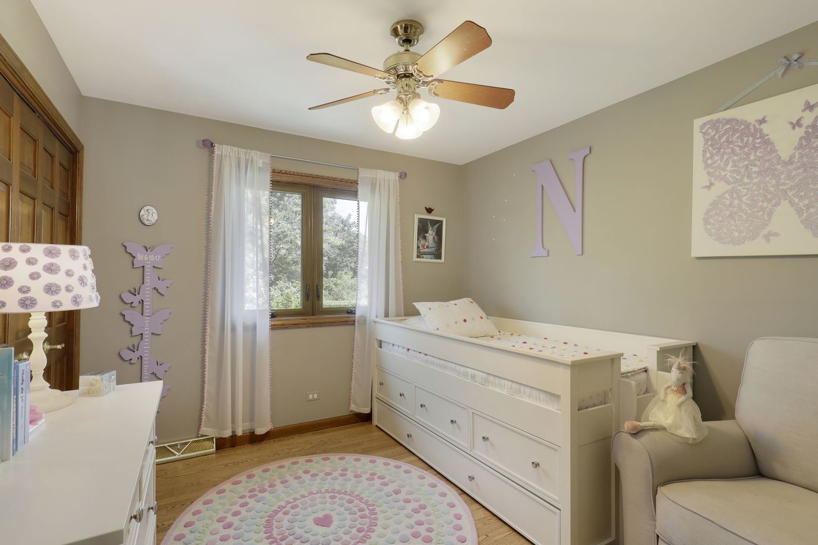 11400 Burr Oak Lane Burr Ridge, IL 60527 - Photo 22 of 40 a room with a baby bed furniture and a window