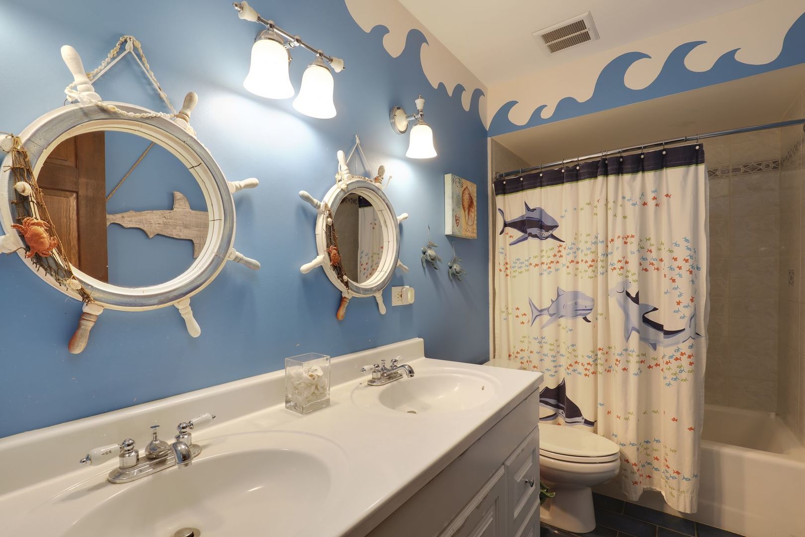 11400 Burr Oak Lane Burr Ridge, IL 60527 - Photo 27 of 40 a bathroom with a toilet a sink and a mirror