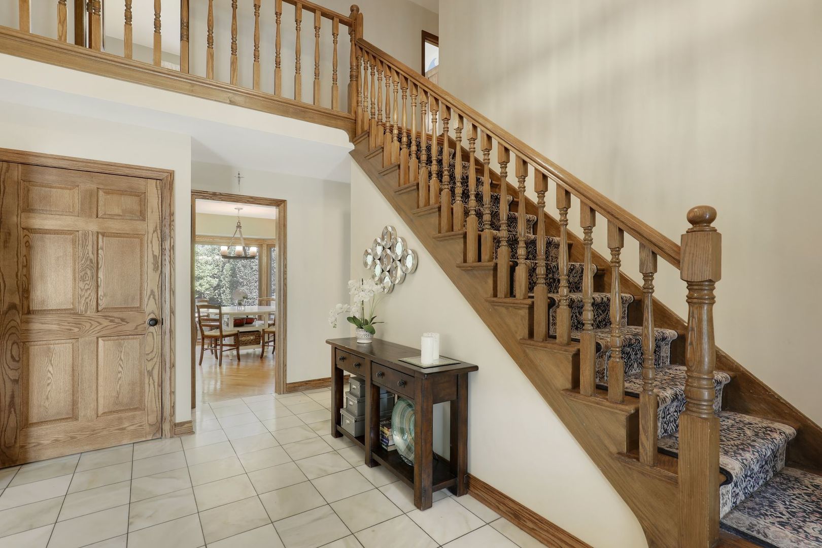 11400 Burr Oak Lane Burr Ridge, IL 60527 - Photo 28 of 40 a view of entryway and hall with wooden floor