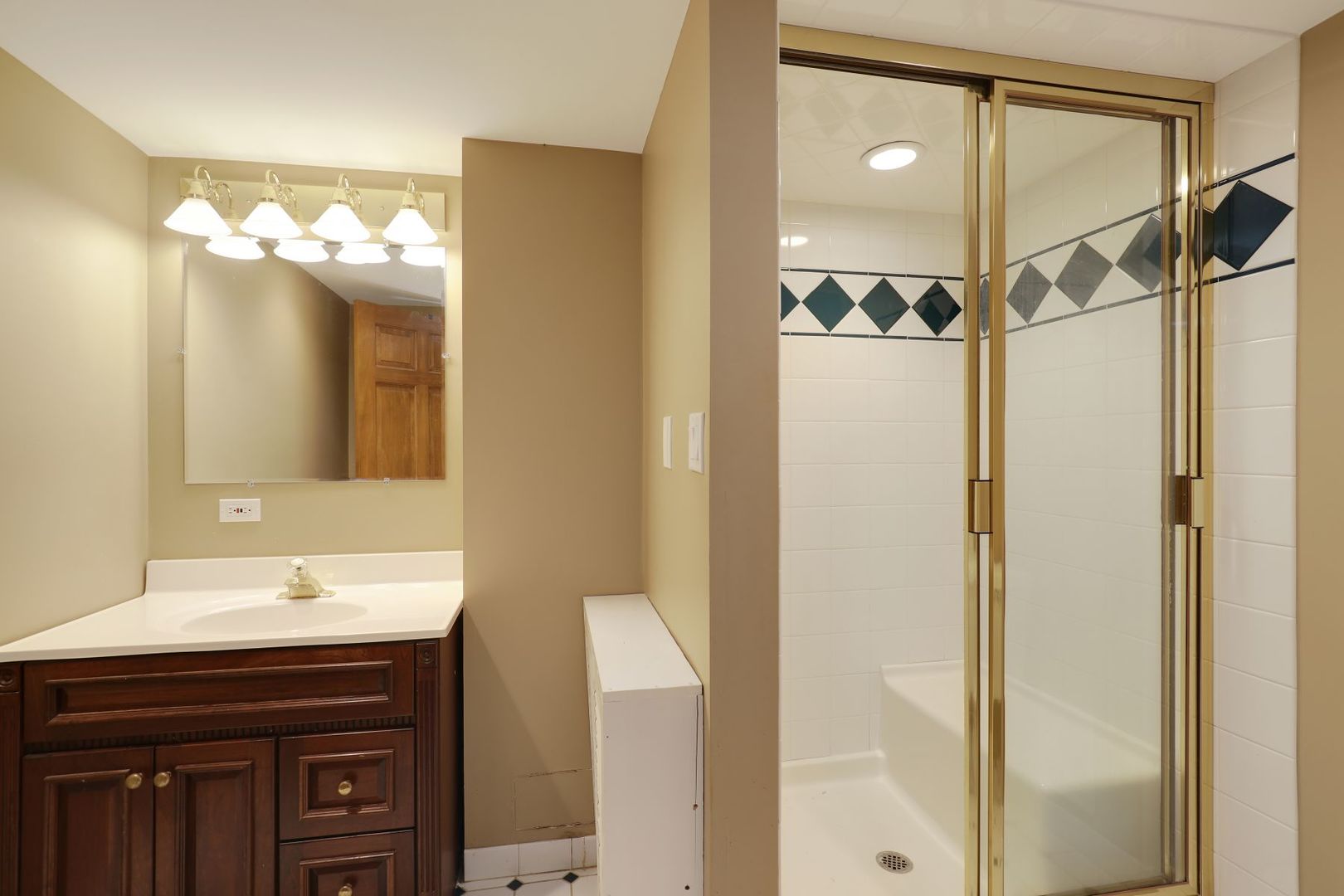 11400 Burr Oak Lane Burr Ridge, IL 60527 - Photo 30 of 40 a bathroom with a sink vanity and a mirror