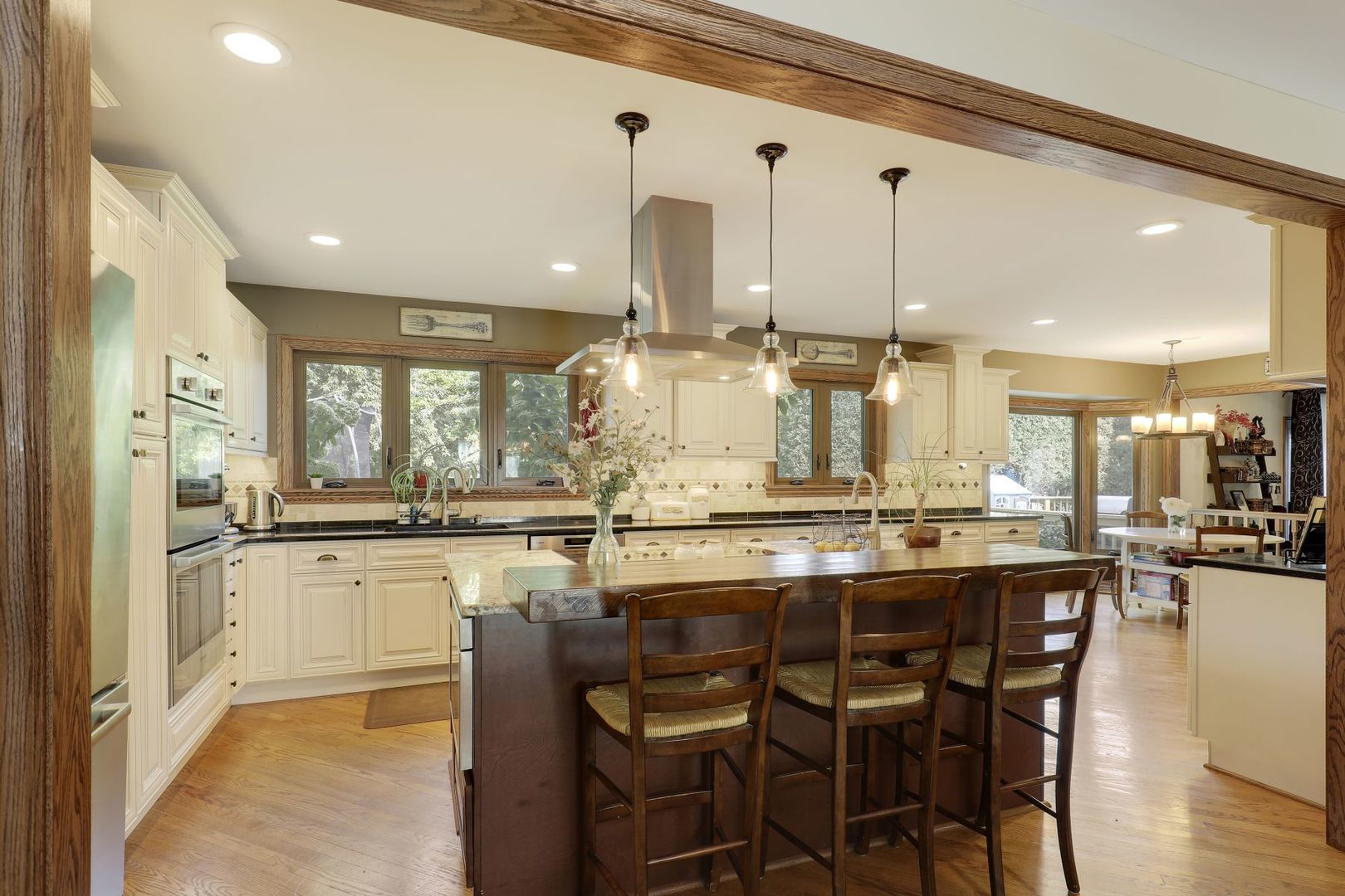 11400 Burr Oak Lane Burr Ridge, IL 60527 - Photo 3 of 40 a kitchen with center island table and chairs
