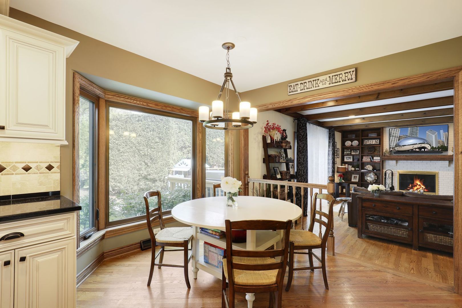 11400 Burr Oak Lane Burr Ridge, IL 60527 - Photo 9 of 40 a dining room with furniture a chandelier and window