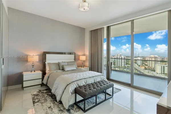 a bathroom with a double vanity sink toilet and shower