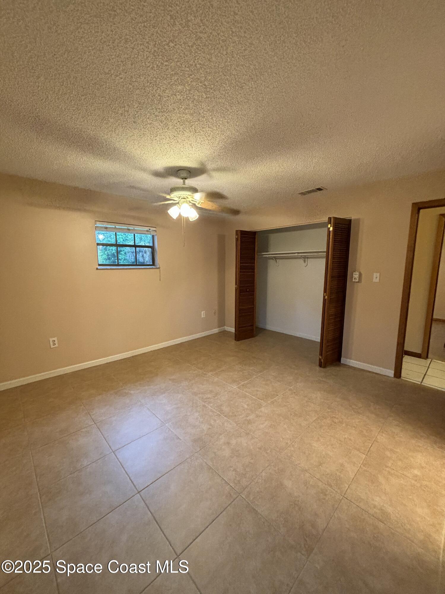 1201 Northeast Tropicana Road Palm Bay, FL 32905 - Photo 12 of 23 a view of an empty room