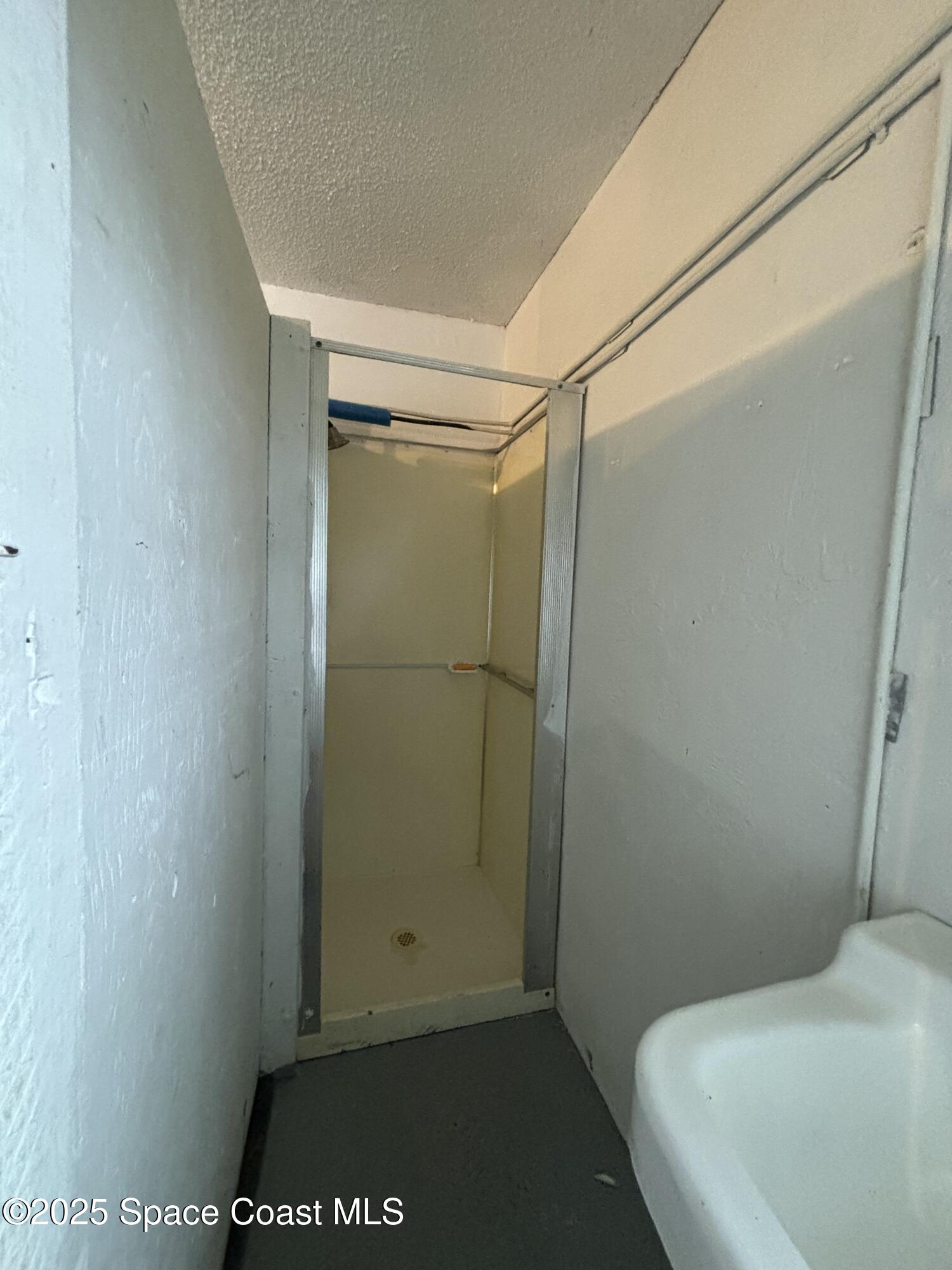 1201 Northeast Tropicana Road Palm Bay, FL 32905 - Photo 21 of 23 a bathroom with a shower