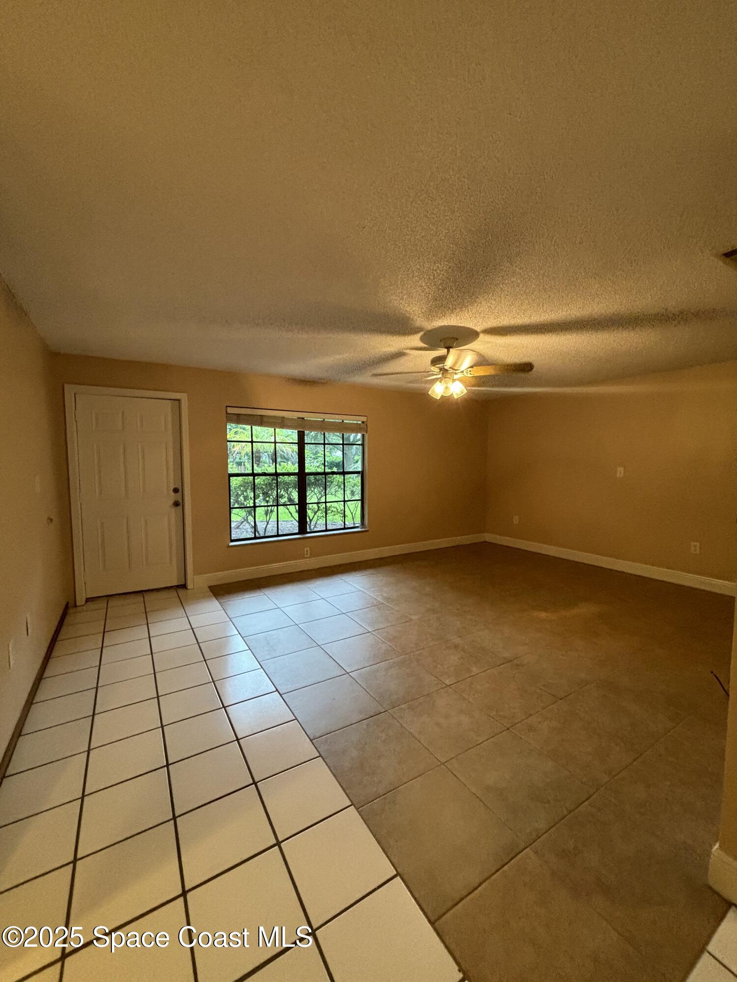 1201 Northeast Tropicana Road Palm Bay, FL 32905 - Photo 5 of 23 a view of empty room