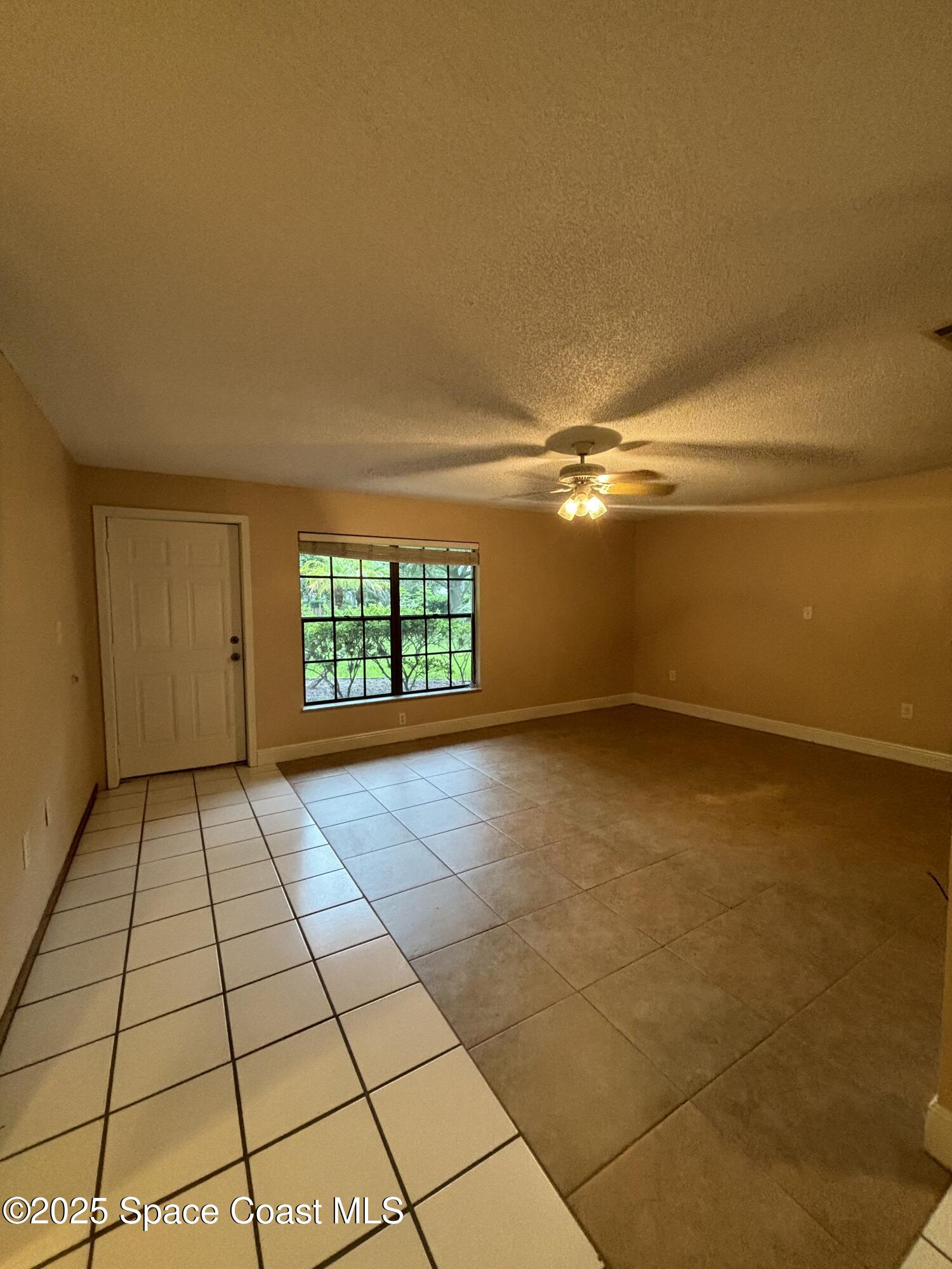 1201 Northeast Tropicana Road Palm Bay, FL 32905 - Photo 6 of 23 a view of an empty room and window