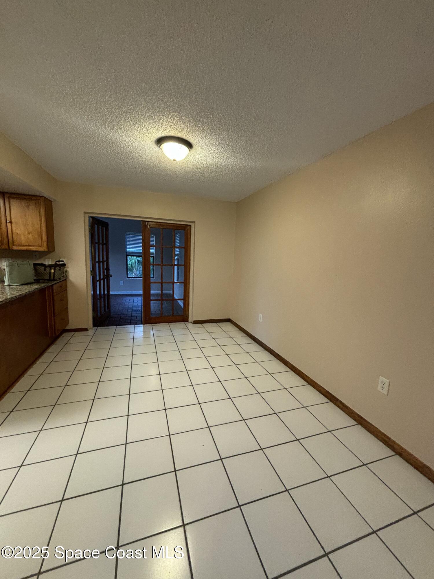 1201 Northeast Tropicana Road Palm Bay, FL 32905 - Photo 8 of 23 a view of an empty room and window
