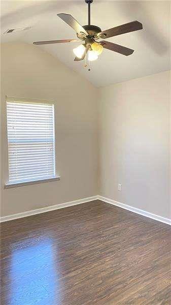4408 Black Hills Drive Northwest Kennesaw, GA 30144 - Photo 16 of 33 a view of an empty room with wooden floor and a fan