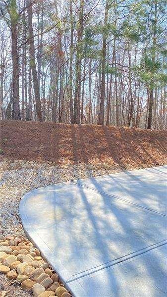 4408 Black Hills Drive Northwest Kennesaw, GA 30144 - Photo 24 of 33 a view of a yard with large trees