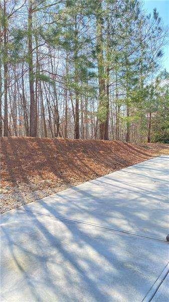 4408 Black Hills Drive Northwest Kennesaw, GA 30144 - Photo 25 of 33 a view of a yard with plants and trees