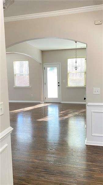 4408 Black Hills Drive Northwest Kennesaw, GA 30144 - Photo 6 of 33 an empty room with wooden floor and windows