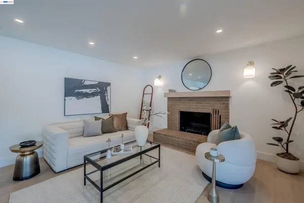 a room with furniture and a potted plant