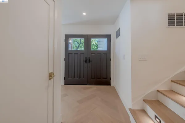 a view of entryway with wooden floor