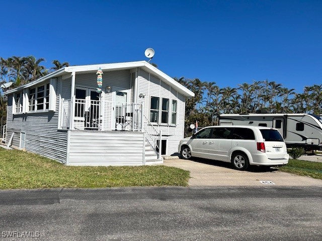 19681 Summerlin Road, Unit 404 Fort Myers, FL 33908 - Photo 2 of 34 a view of street with parked cars