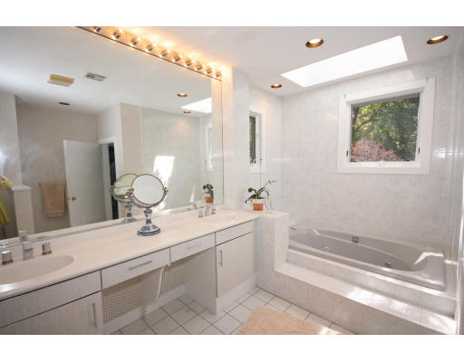 361 Dudley Road Newton, MA 02459 - Photo 11 of 13 a bathroom with a sink double vanity granite and a mirror