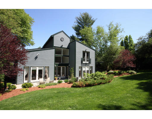 361 Dudley Road Newton, MA 02459 - Photo 13 of 13 a front view of a house with a garden