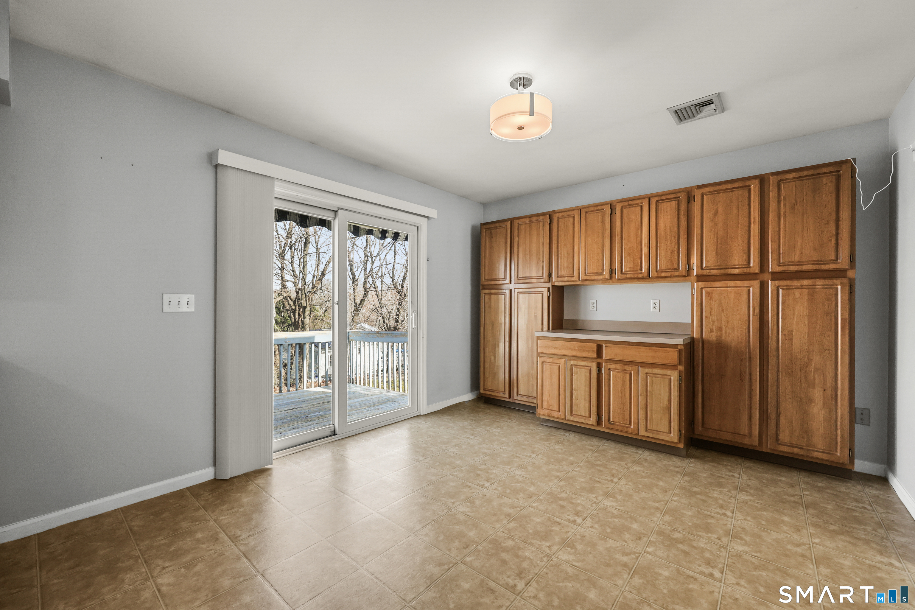 38 Norway Street Watertown, CT 06779 - Photo 3 of 15 a view of an empty room with a window and kitchen view