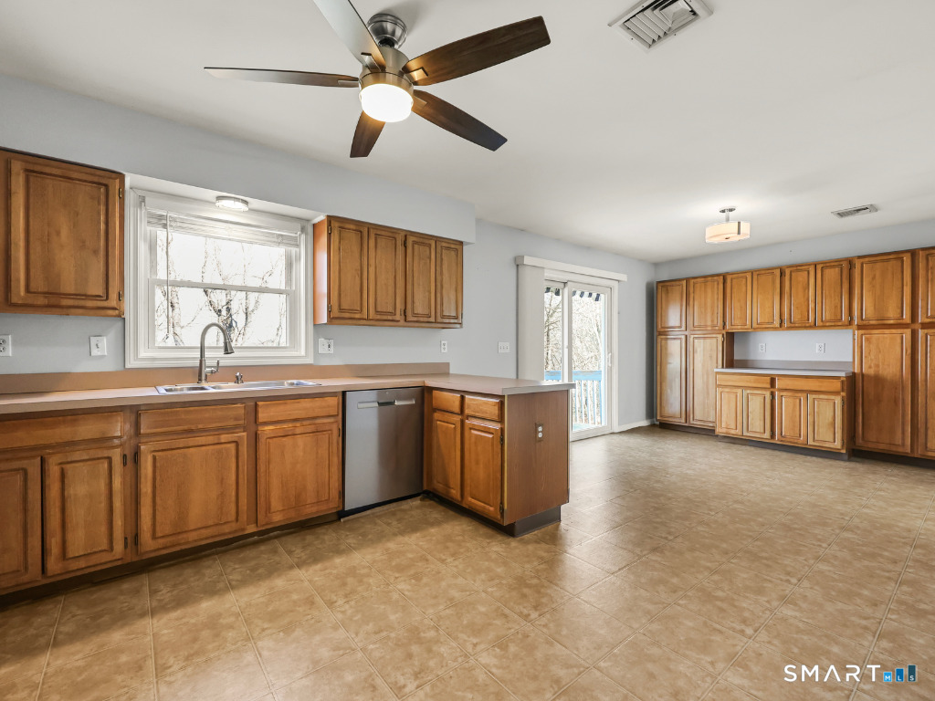 38 Norway Street Watertown, CT 06779 - Photo 4 of 15 a large kitchen with a window and a sink