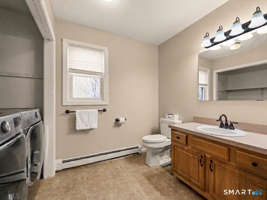 38 Norway Street Watertown, CT 06779 - Photo 9 of 15 a bathroom with a toilet sink double vanity and mirror