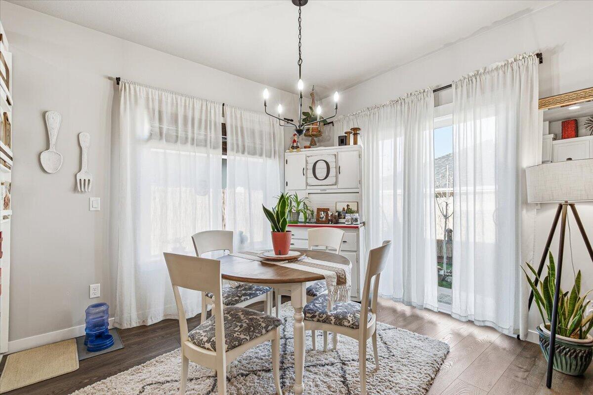 248 Christopher Way Talent, OR 97540 - Photo 9 of 33 a view of a dining room with furniture window and wooden floor