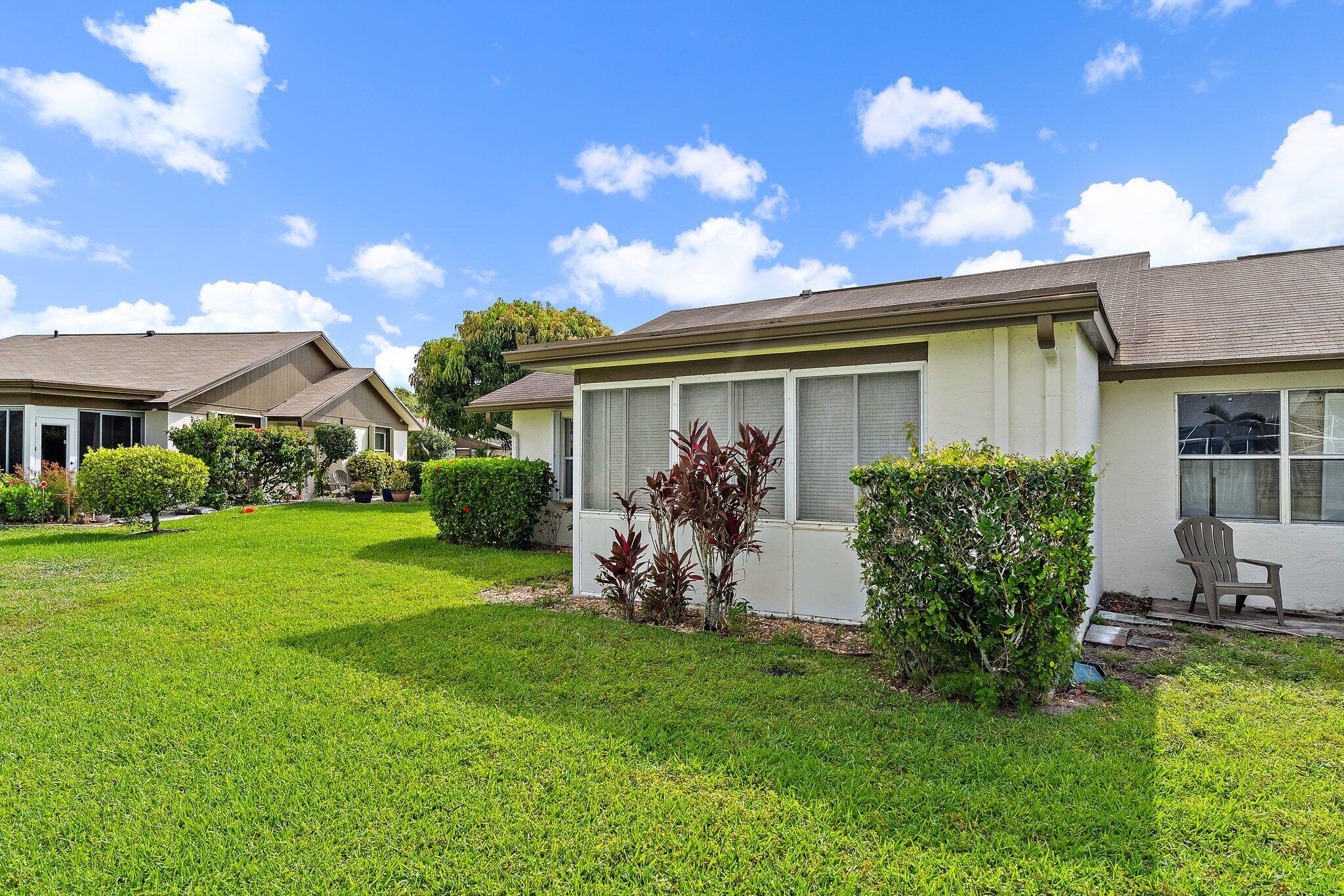 109 Doe Trail Jupiter, FL 33458 - Photo 26 of 26 a view of a house with a yard porch and sitting area
