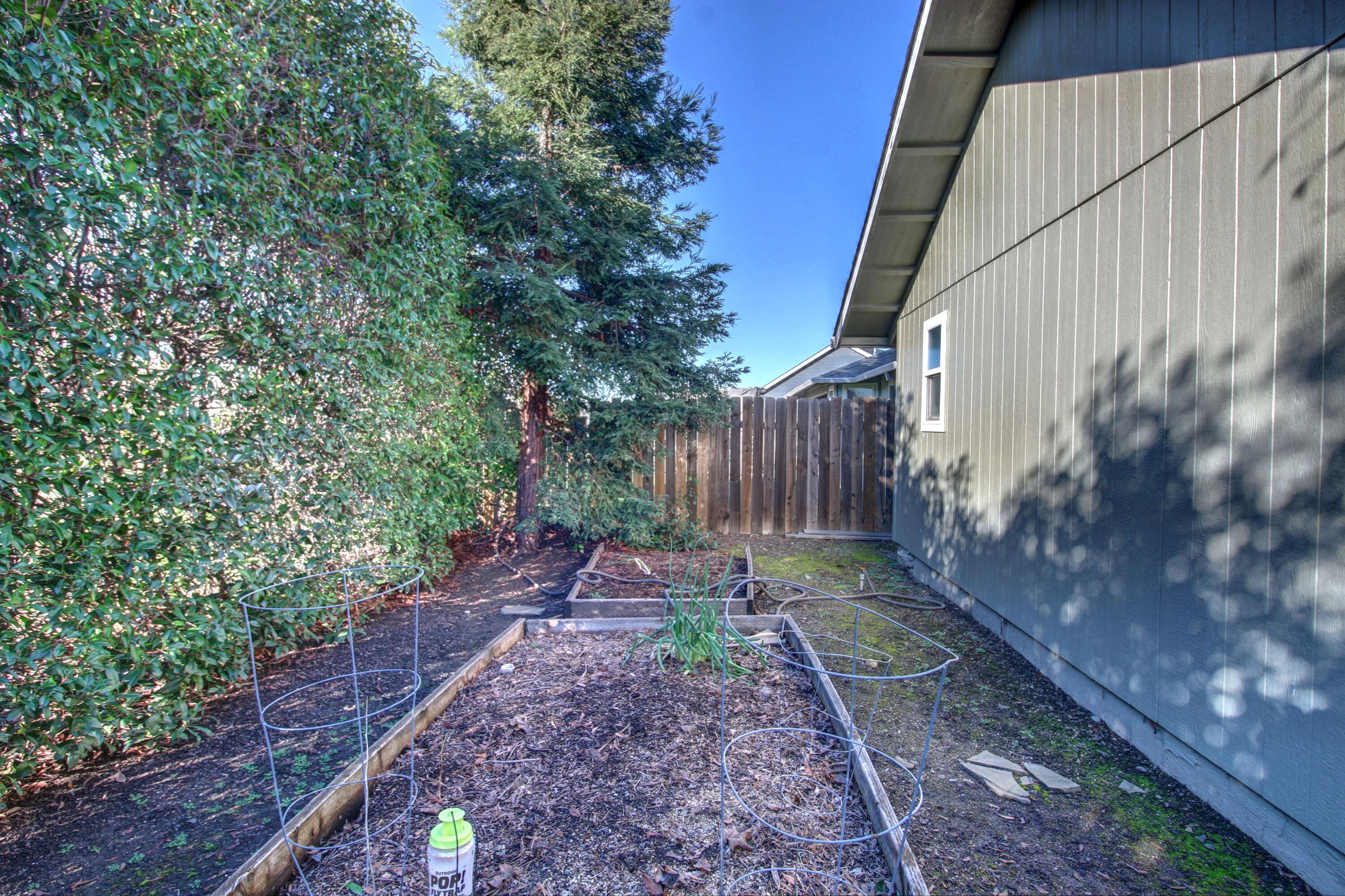 2683 Merriman Road Medford, OR 97501 - Photo 21 of 23 a backyard of a house with lots of green space