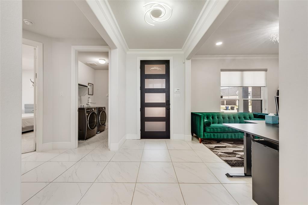 2341 Haft River Road Frisco, TX 75034 - Photo 2 of 36 Foyer entrance featuring crown molding, washing machine and clothes dryer, and recessed lighting