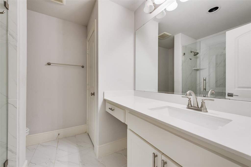 2341 Haft River Road Frisco, TX 75034 - Photo 30 of 36 Full bath featuring light marble finish floors, vanity, and a marble finish shower