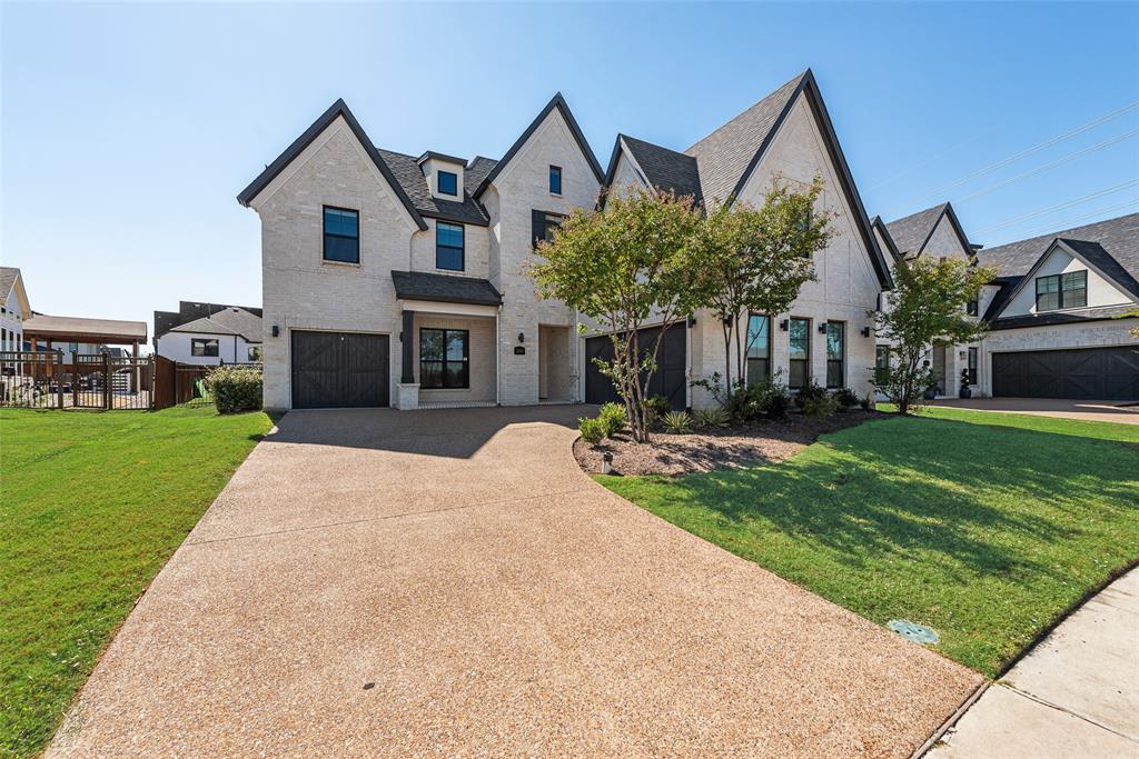 2341 Haft River Road Frisco, TX 75034 - Photo 32 of 36 View of front facade with brick siding, driveway, and a garage