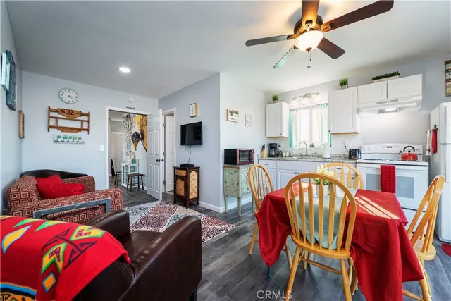 a kitchen with stainless steel appliances granite countertop white cabinets sink and stove