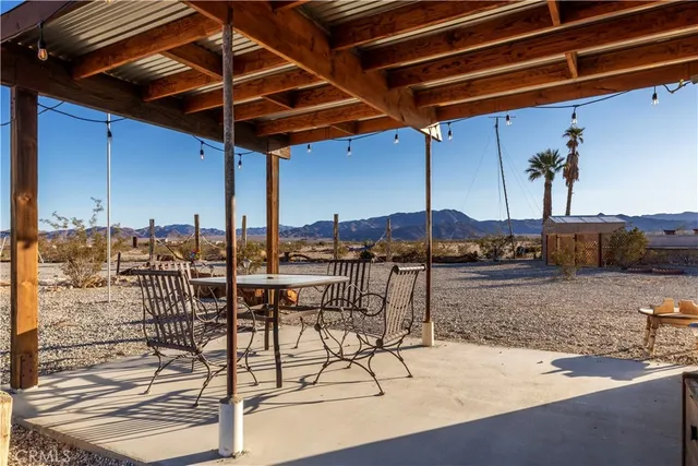 a view of a terrace with yard